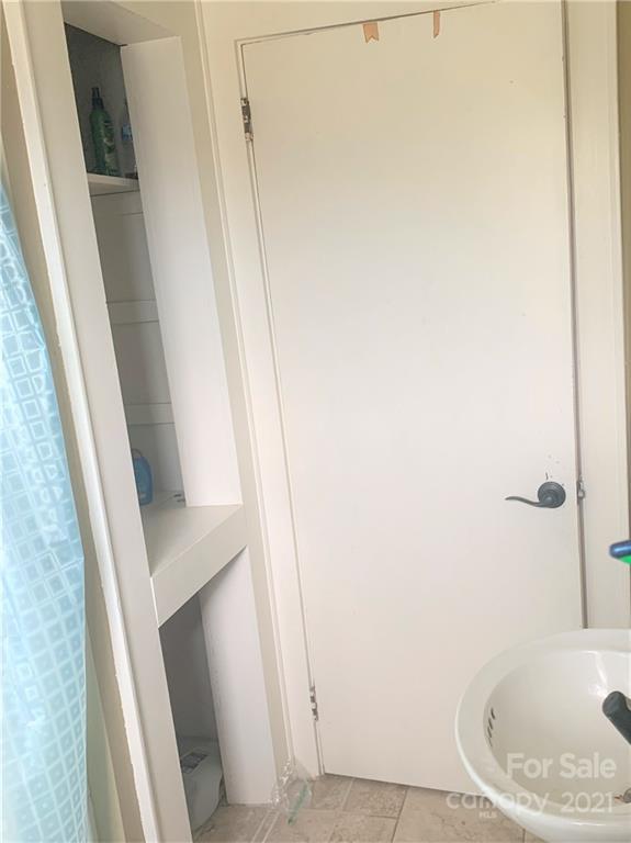 4215 Poplar Tent Road Concord, NC 28027 - Photo 16 of 22 a bathroom with a sink and a tub