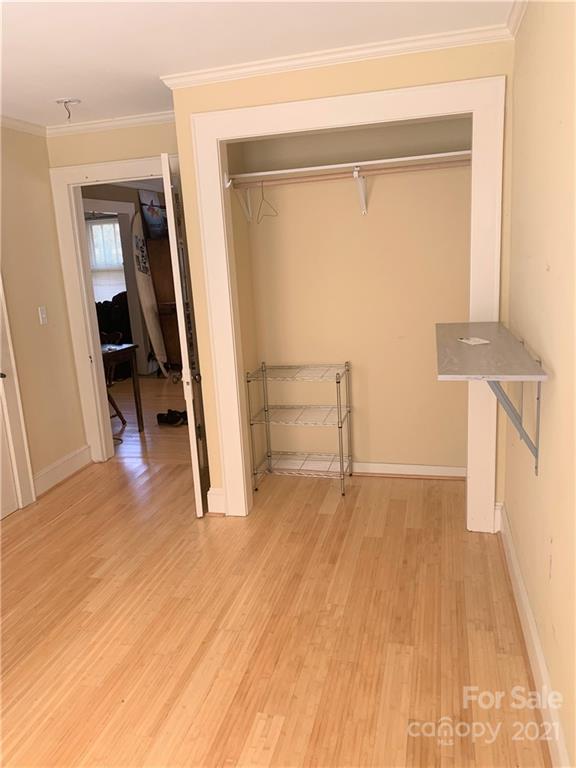 4215 Poplar Tent Road Concord, NC 28027 - Photo 18 of 22 wooden floor in an empty room with a window