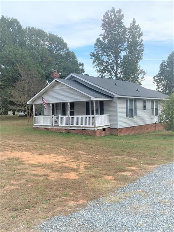 4215 Poplar Tent Road Concord, NC 28027 - Photo 3 of 22 a house with swimming pool in front of it