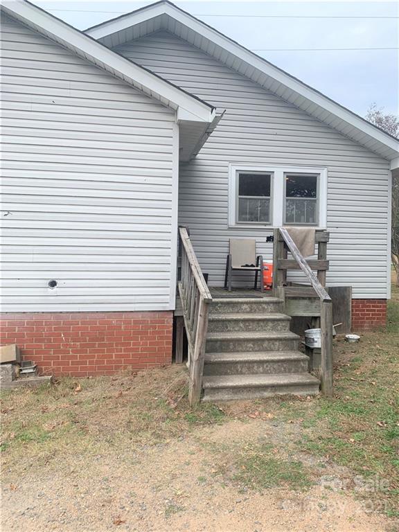 4215 Poplar Tent Road Concord, NC 28027 - Photo 21 of 22 a view of a patio with a table and chairs