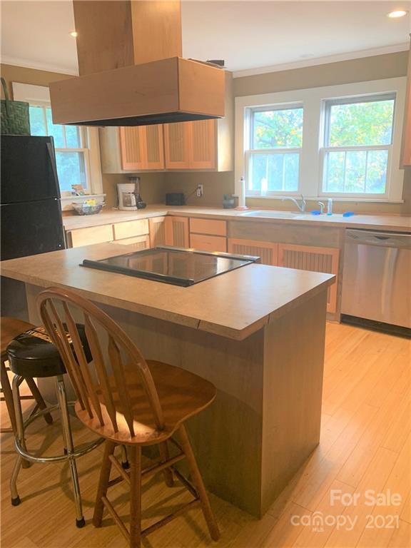 4215 Poplar Tent Road Concord, NC 28027 - Photo 4 of 22 a kitchen with a sink a counter top space and a large window