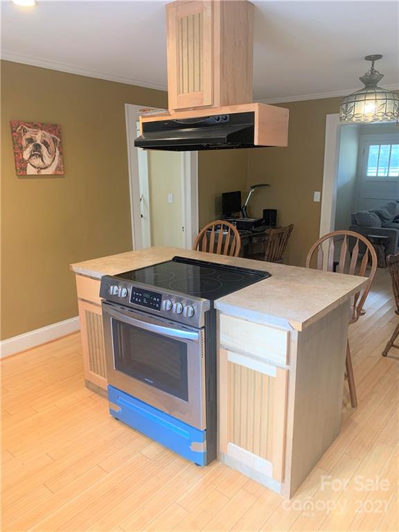 4215 Poplar Tent Road Concord, NC 28027 - Photo 6 of 22 a kitchen with stainless steel appliances granite countertop a stove and a sink