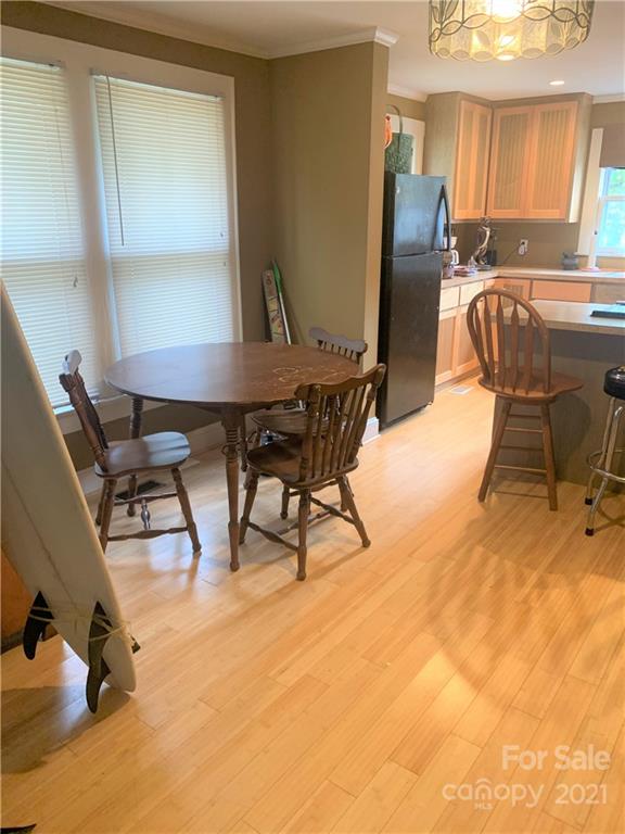 4215 Poplar Tent Road Concord, NC 28027 - Photo 7 of 22 a view of a dining room with furniture and a window