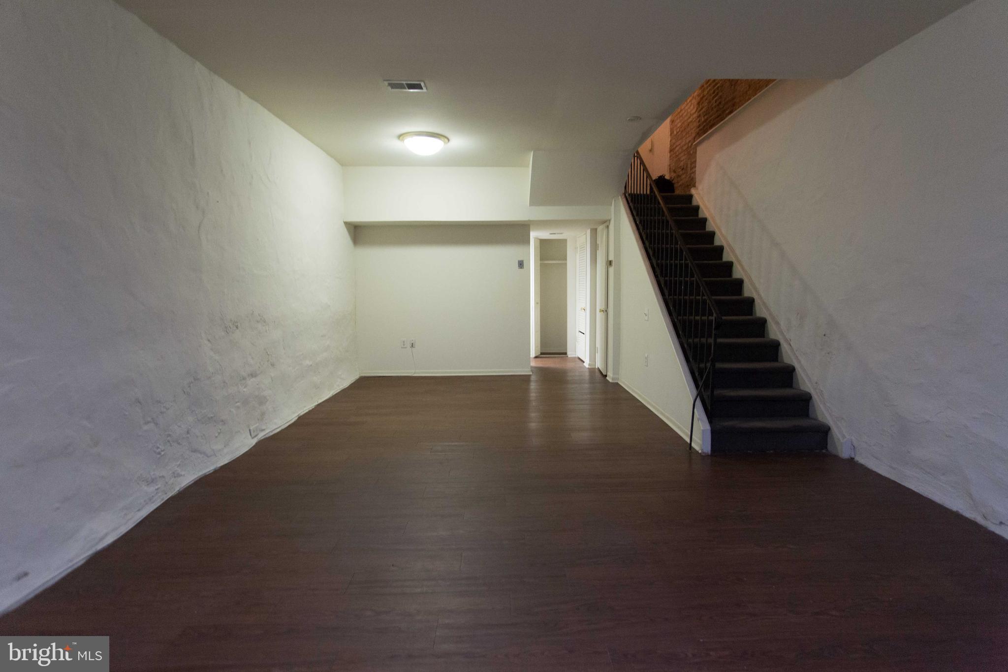 2031-8 South Street, Unit 123 Philadelphia, PA 19146 - Photo 14 of 31 a view of a hallway with stairs