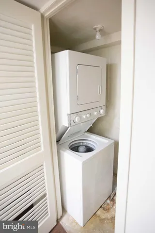 a bathroom with a sink and washing machine
