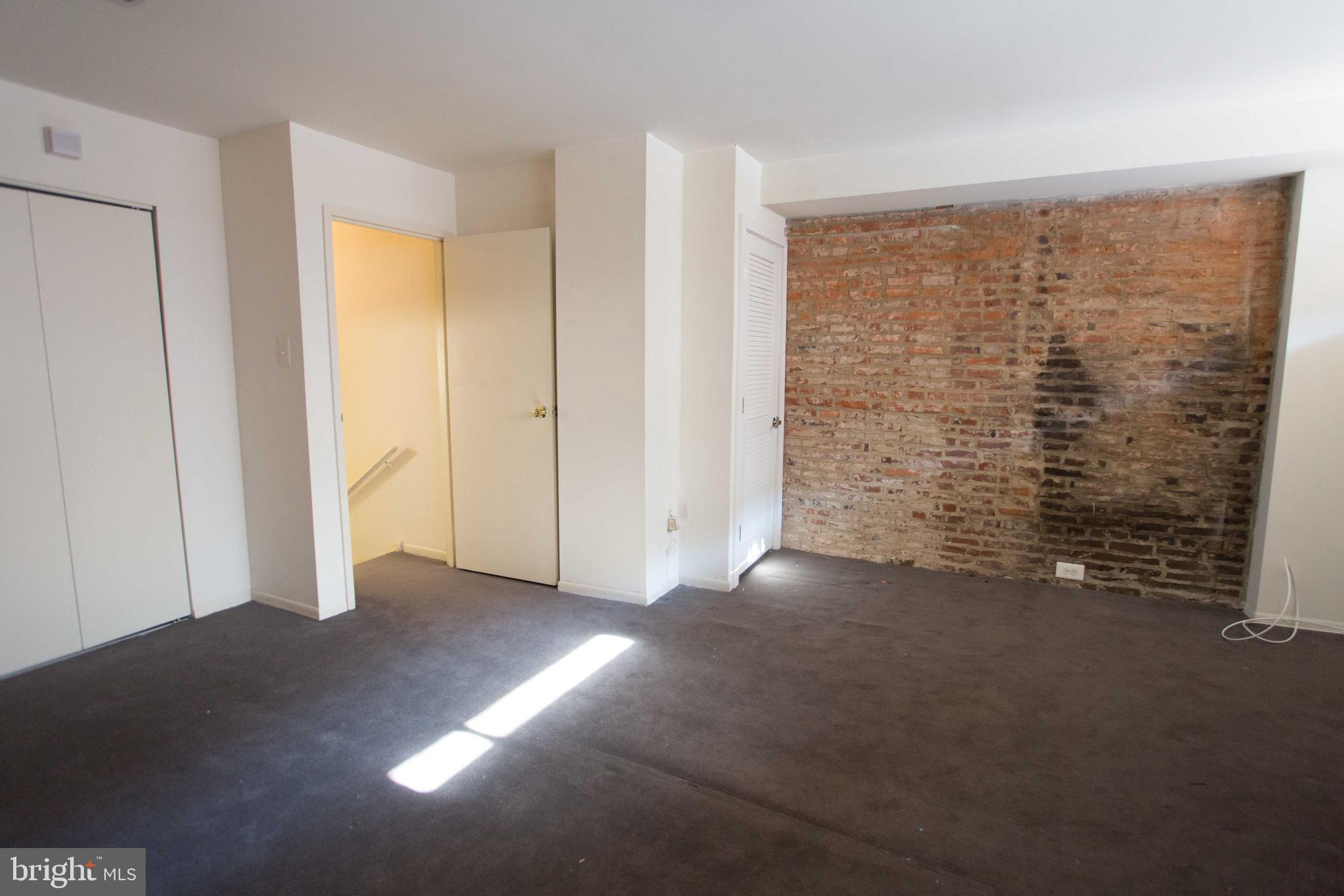 2031-8 South Street, Unit 123 Philadelphia, PA 19146 - Photo 24 of 31 a view of a room with an empty space