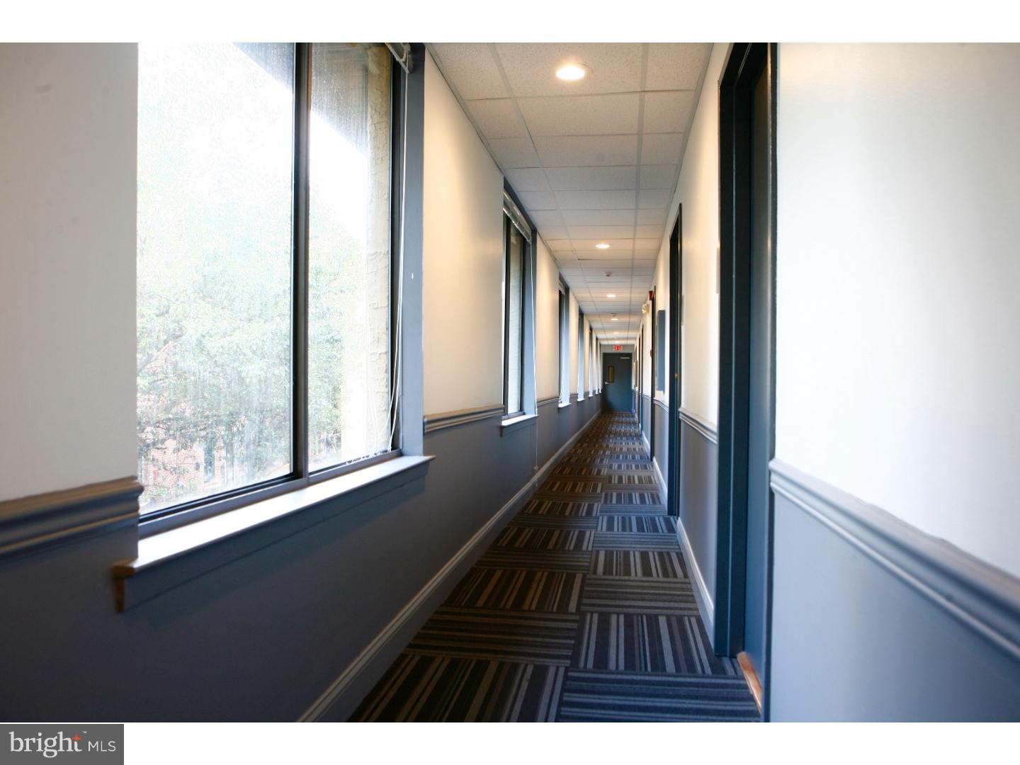 2031-8 South Street, Unit 123 Philadelphia, PA 19146 - Photo 9 of 31 a view of balcony with wooden floor