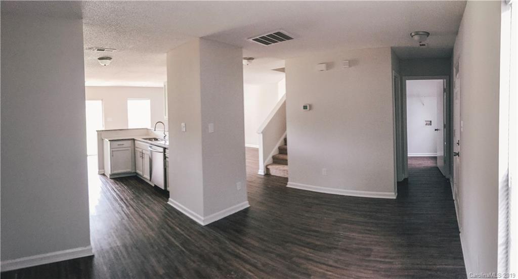 2039 Pimpernel Road Charlotte, NC 28213 - Photo 13 of 44 a view of a hallway with wooden floor and closet
