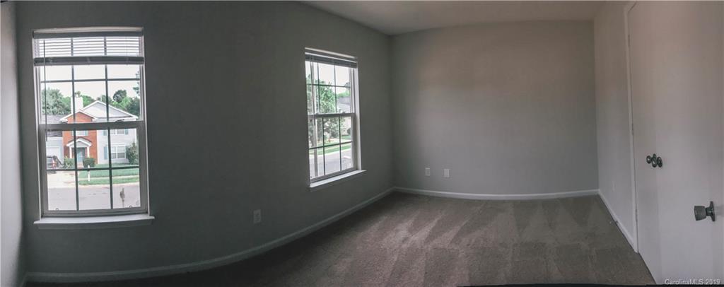 2039 Pimpernel Road Charlotte, NC 28213 - Photo 17 of 44 an empty room with windows