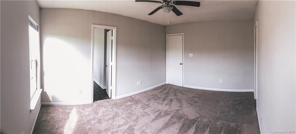 2039 Pimpernel Road Charlotte, NC 28213 - Photo 18 of 44 an empty room with a empty space and chandelier fan