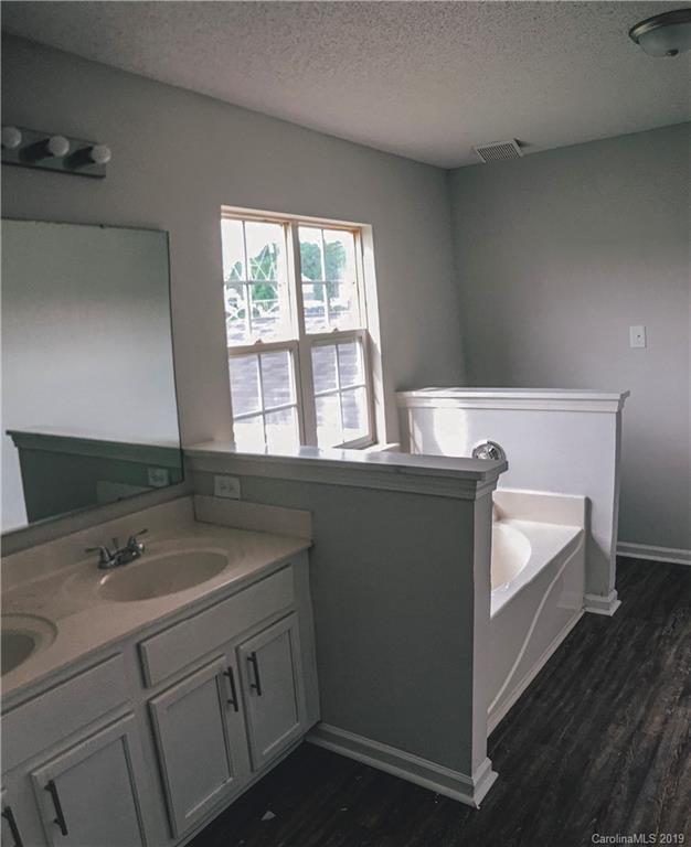 2039 Pimpernel Road Charlotte, NC 28213 - Photo 19 of 44 a bathroom with a sink and a window