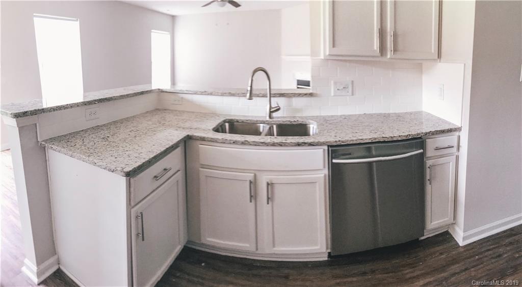 2039 Pimpernel Road Charlotte, NC 28213 - Photo 25 of 44 a kitchen with a sink and cabinets