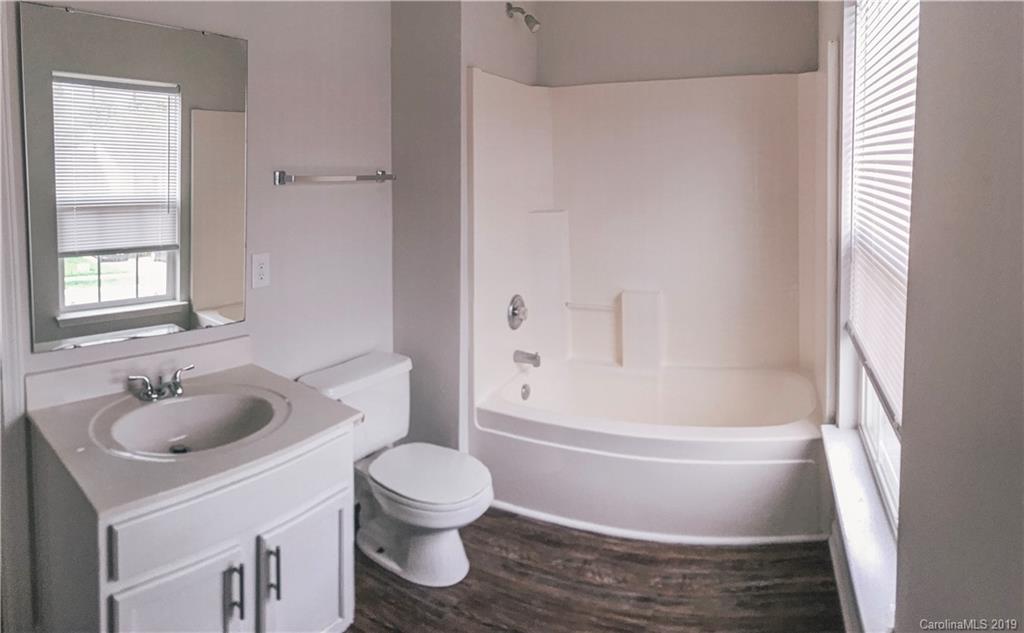 2039 Pimpernel Road Charlotte, NC 28213 - Photo 31 of 44 a bathroom with a sink toilet and shower