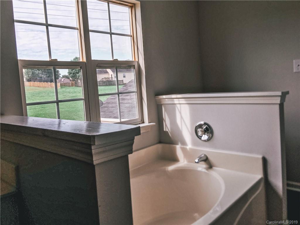 2039 Pimpernel Road Charlotte, NC 28213 - Photo 32 of 44 a bathroom with a tub and sink
