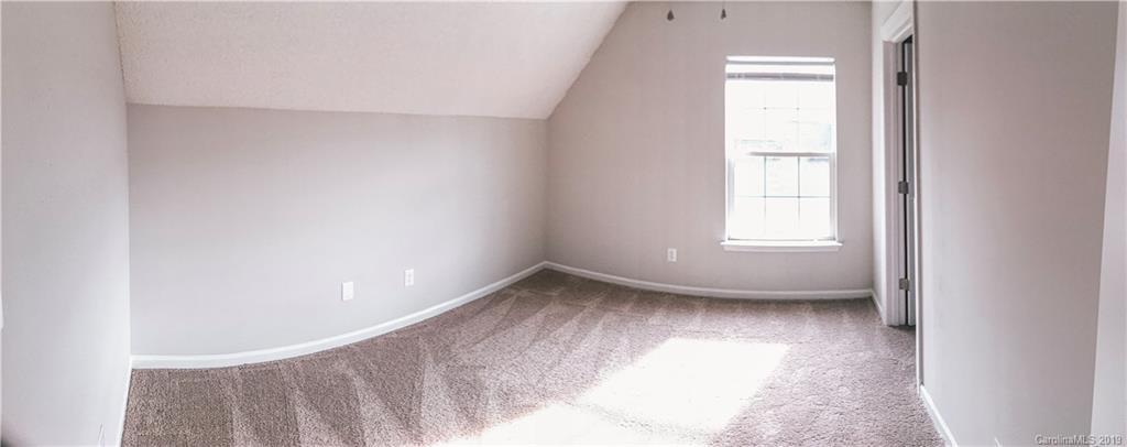 2039 Pimpernel Road Charlotte, NC 28213 - Photo 35 of 44 a view of empty room with wooden floor and fan