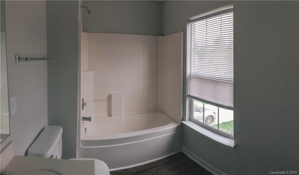 2039 Pimpernel Road Charlotte, NC 28213 - Photo 38 of 44 a white bath tub sitting next to a window