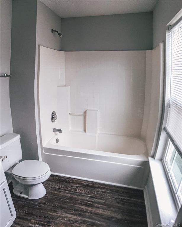 2039 Pimpernel Road Charlotte, NC 28213 - Photo 43 of 44 a bathroom with a toilet and a shower