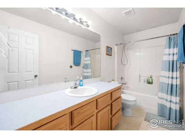 a view of city from balcony with seating space