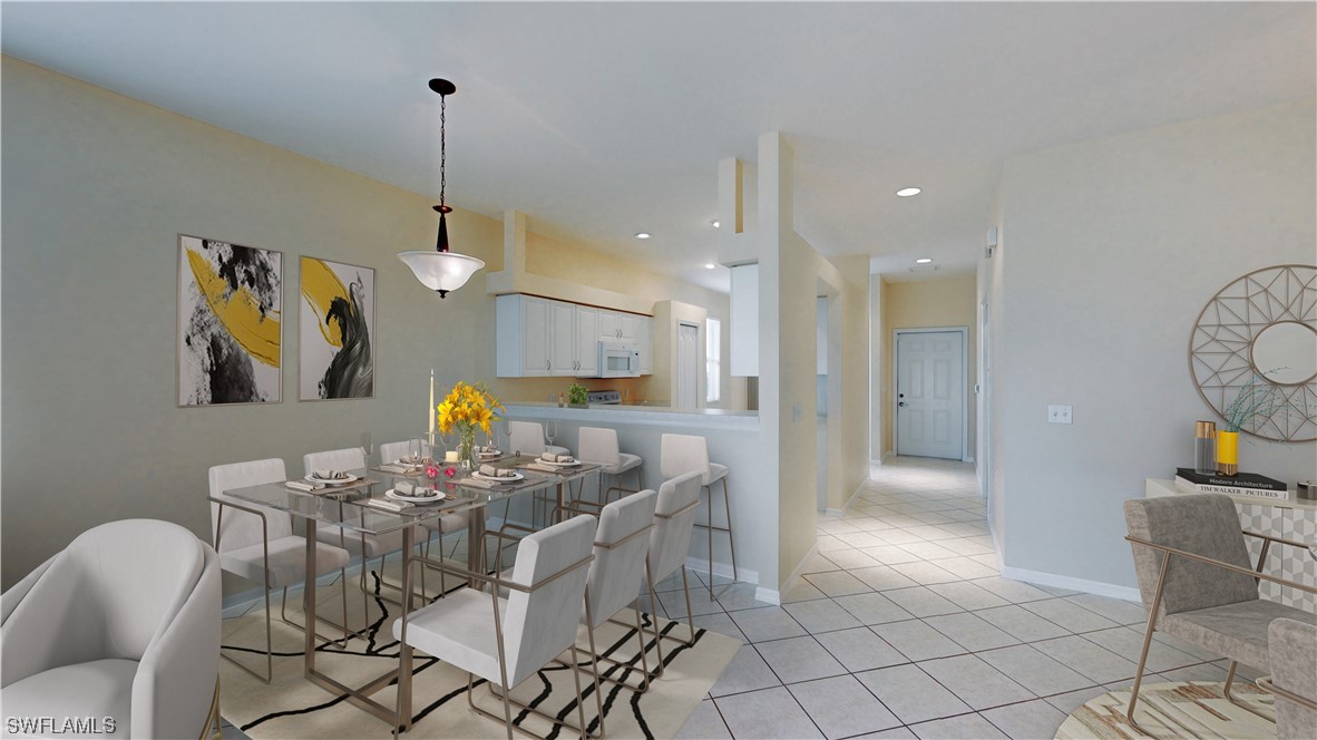 21540 Portrush Run Estero, FL 33928 - Photo 14 of 32 a view of a dining room and livingroom with furniture wooden floor a chandelier