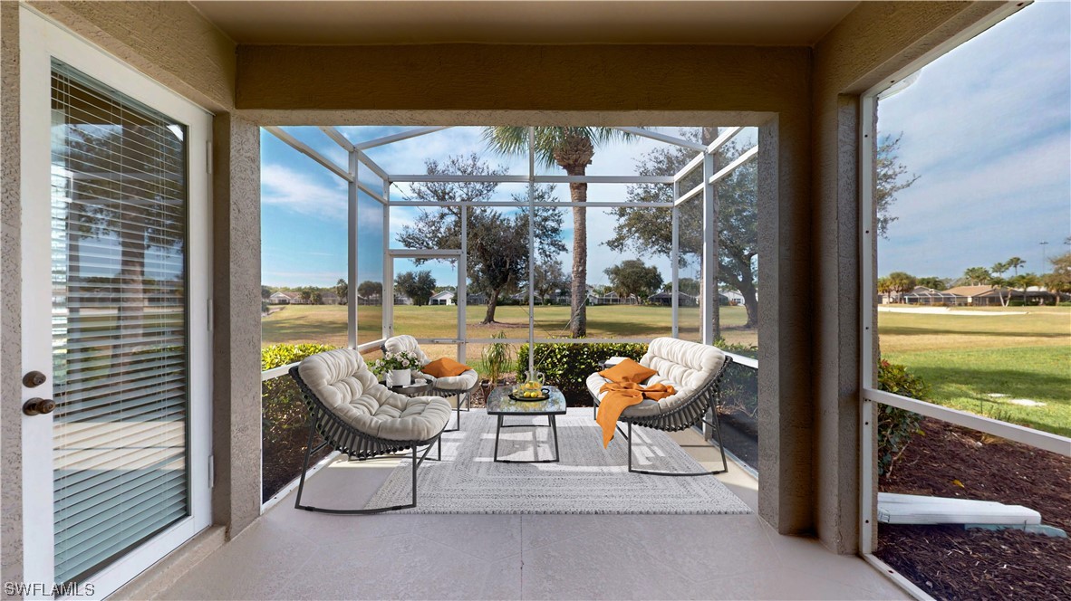 21540 Portrush Run Estero, FL 33928 - Photo 23 of 32 a balcony with furniture and a potted plant