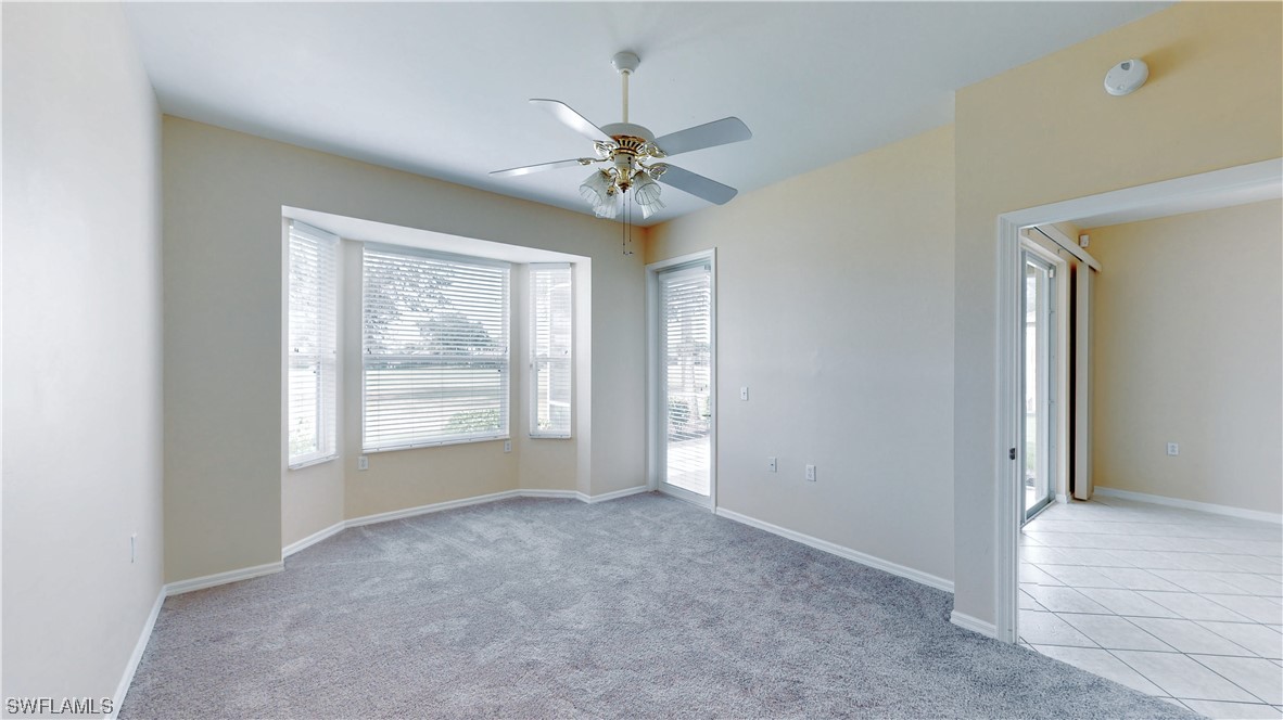 21540 Portrush Run Estero, FL 33928 - Photo 6 of 32 a view of an empty room with a window