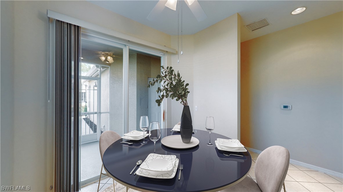 21540 Portrush Run Estero, FL 33928 - Photo 10 of 32 a view of a dining room with furniture