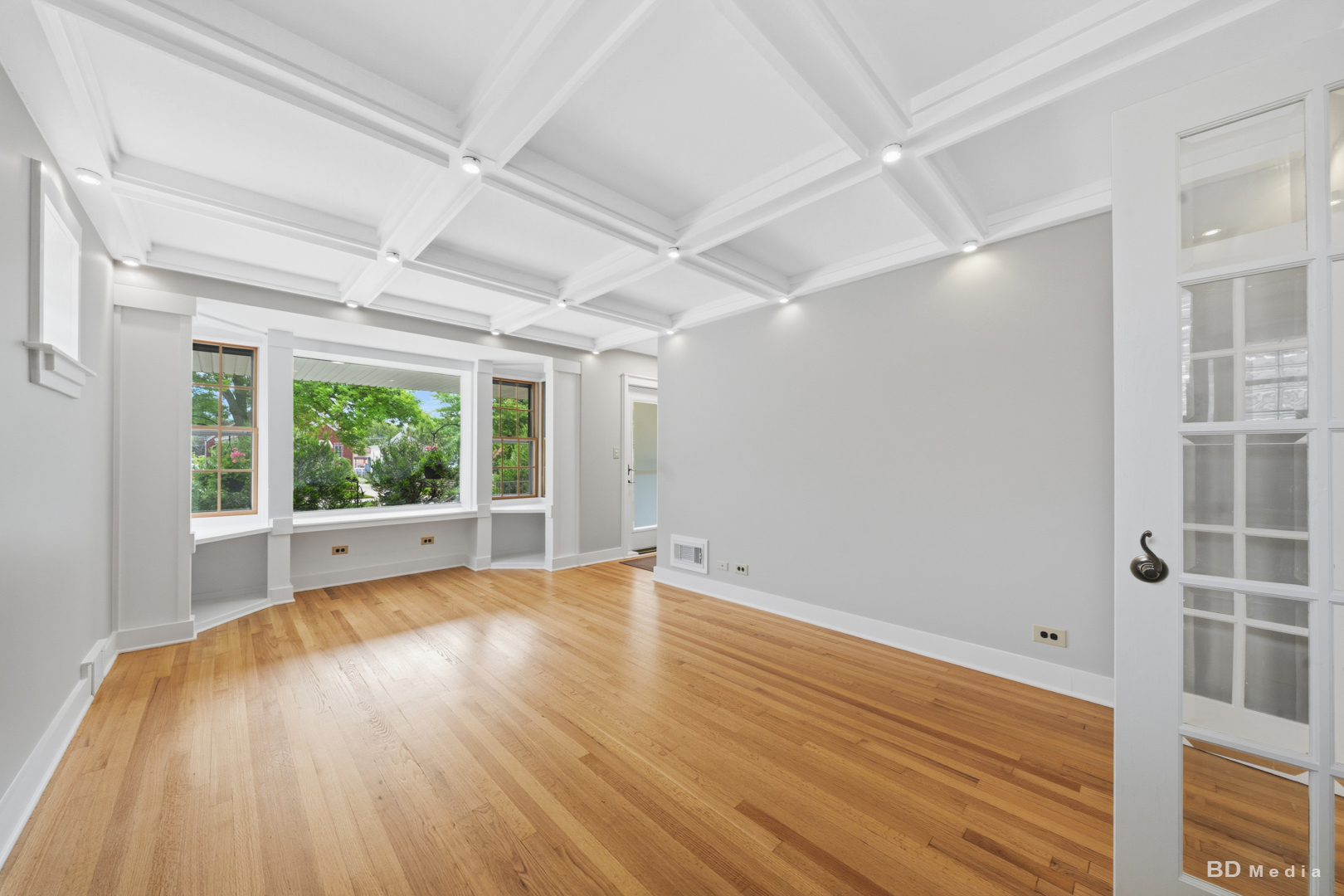 10428 South Springfield Avenue Chicago, IL 60655 - Photo 6 of 43 a view of an empty room with wooden floor and a window