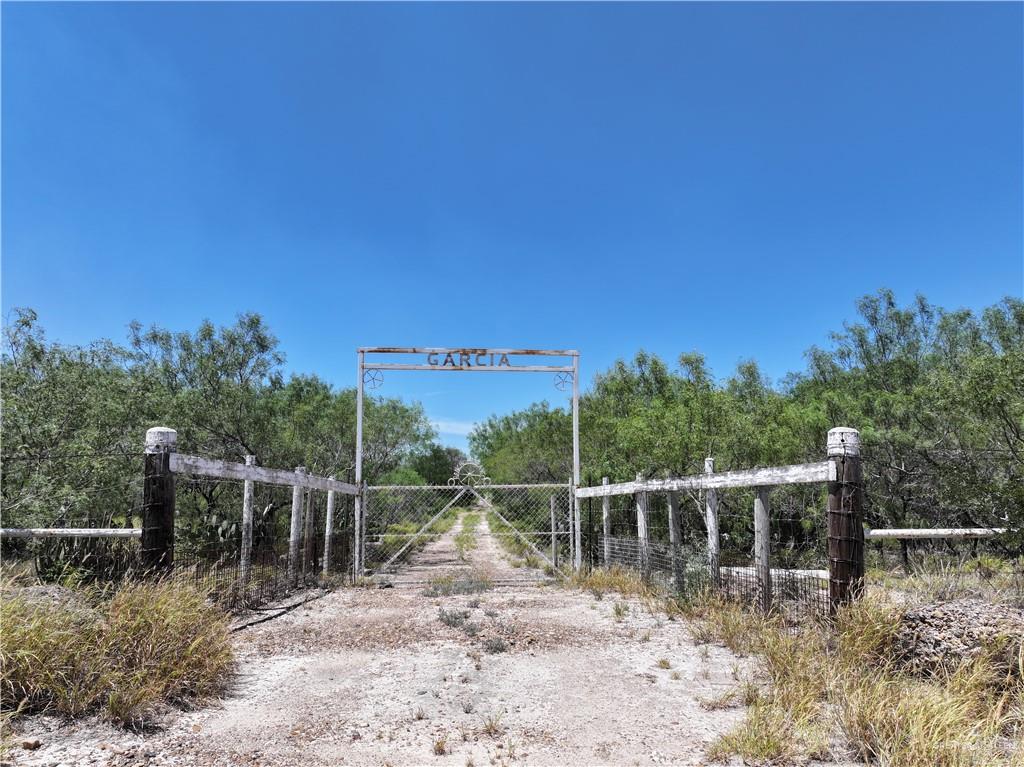 0 Guadalupe Road Sullivan City, TX 78595 - Photo 1 of 2 a view of a yard with wooden fence