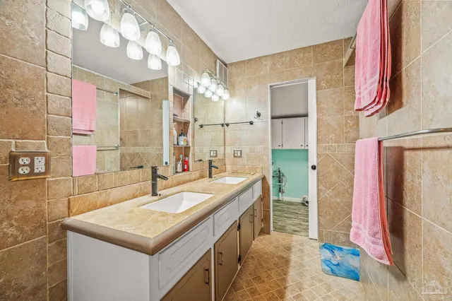 a bathroom with a glass shower door