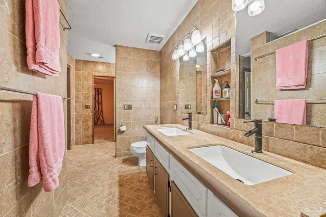 a view of a room with wooden floor and cabinet