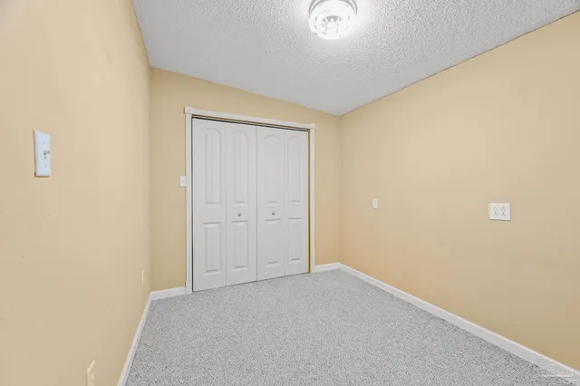 a bathroom with a sink a toilet and shower curtain