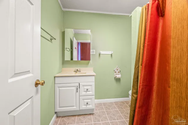 an empty room with a fireplace and fan