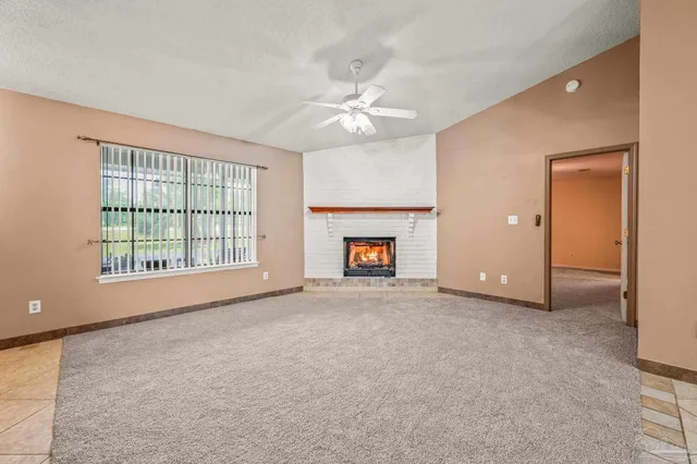 a view of a kitchen with a sink and a window
