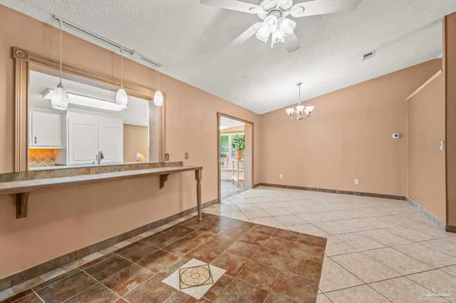a view of a bathroom with a sink and a mirror