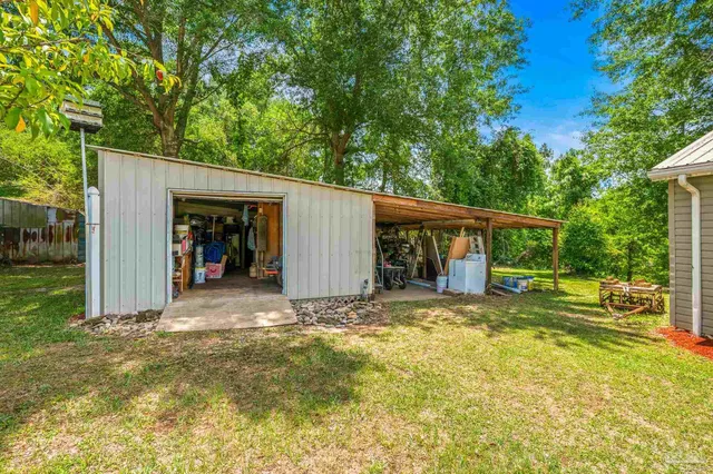a front view of a house with outdoor seating