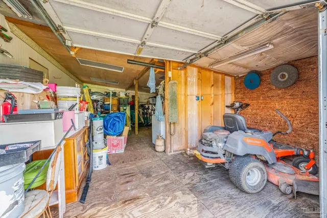 a view of kitchen with sink microwave and refrigerator