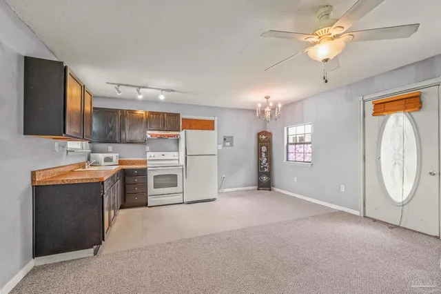 a view of storage and utility room with wooden floor
