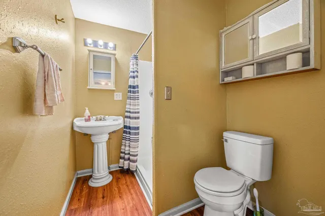 a view of backyard with deck and garden