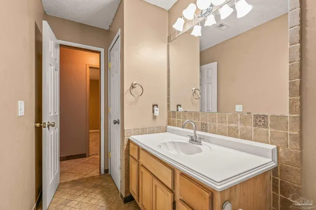 a bathroom with a sink a vanity and a mirror