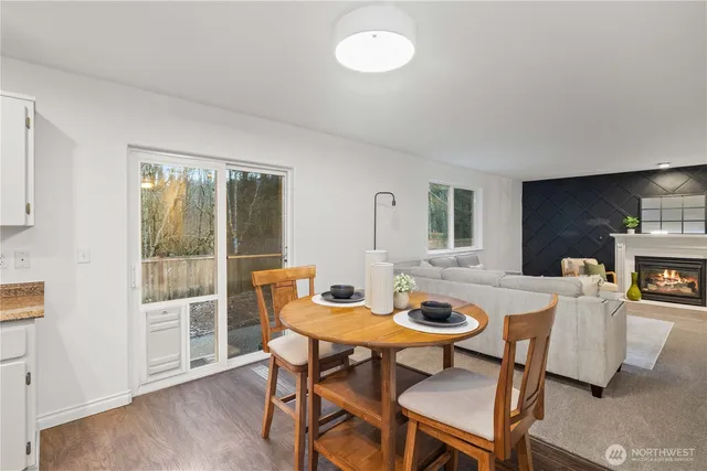 a view of a dining room with furniture and wooden floor