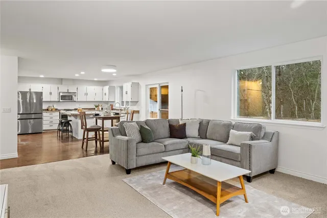a living room with furniture and a table