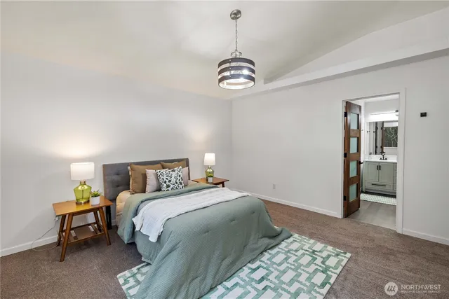 a bedroom with a bed and a table in it