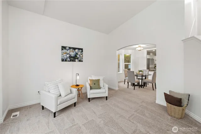 a living room with furniture and a chair