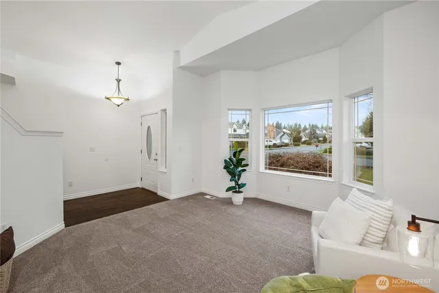 a view of livingroom with furniture wooden floor and window
