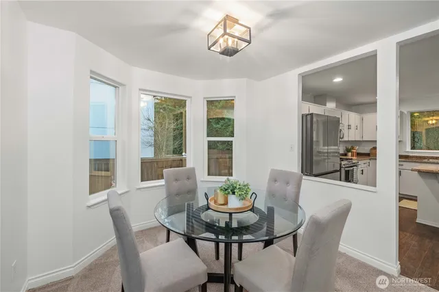 a view of a dining room with furniture window and outside view