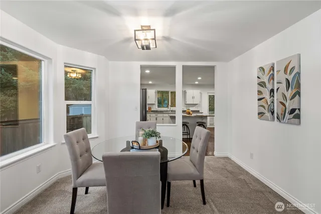 a dining room with furniture and window
