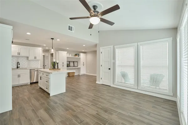 a view of kitchen with wooden floor and window