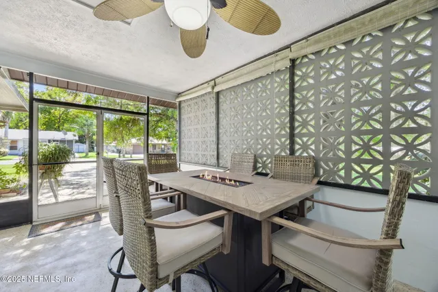 an aerial view of residential houses with outdoor space and swimming pool