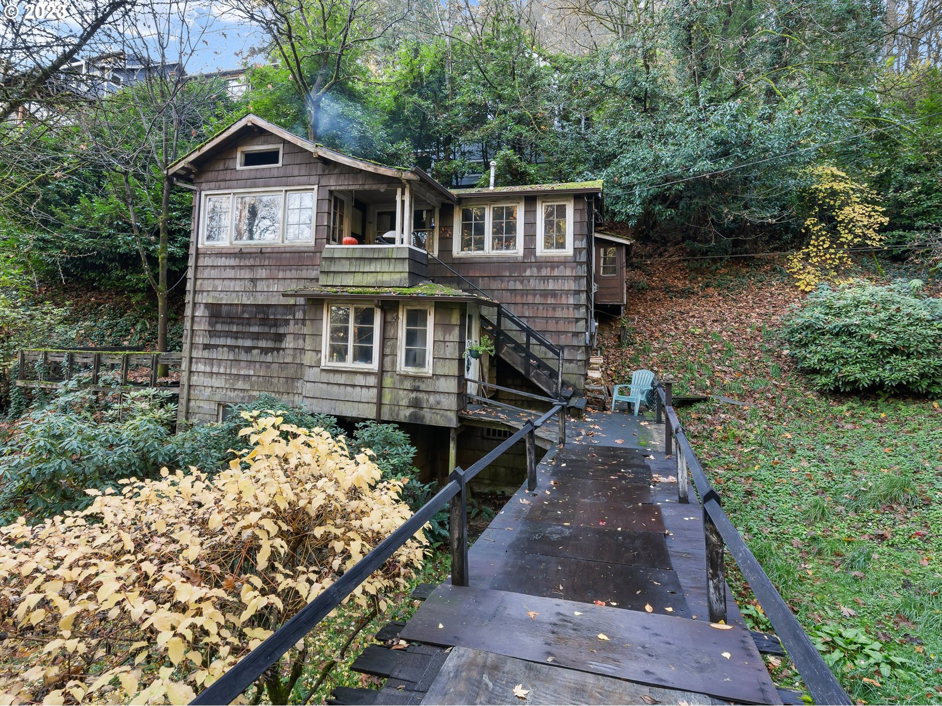 3852 Southwest Condor Avenue Portland, OR 97239 - Photo 11 of 44 a front view of a house with a yard