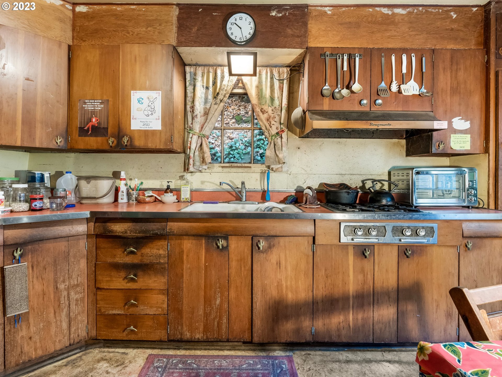 3852 Southwest Condor Avenue Portland, OR 97239 - Photo 17 of 44 a kitchen with a sink and cabinets